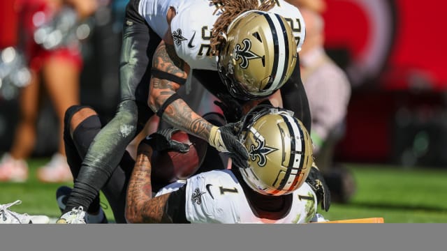New Orleans Saints safety Tyrann Mathieu (32) congratulates cornerback Alontae Taylor (1) after intercepting the ball